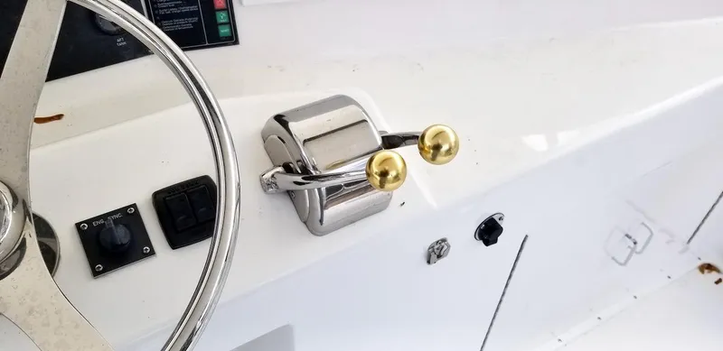 Slide: The Image of Boat steering wheel and throttle controls on a 2001 Post 50 Convertible. - 36