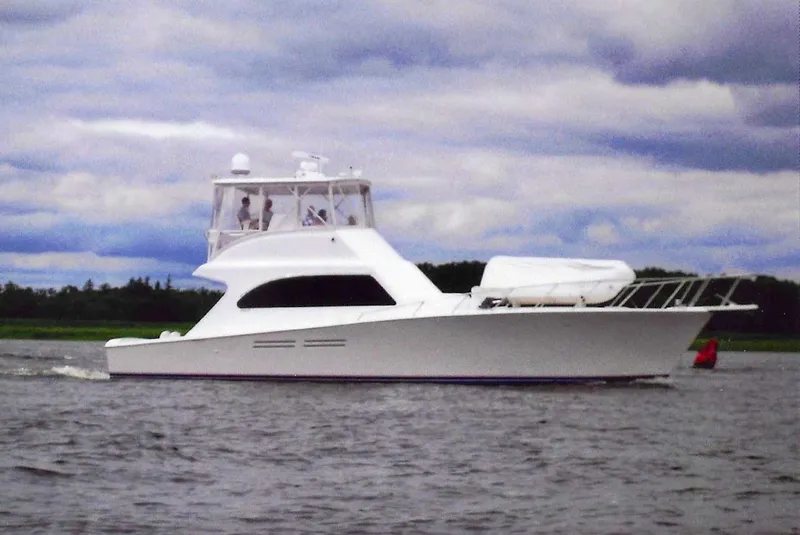 Slide: The Image of White 2001 Post 50 Convertible yacht cruising on a cloudy day. - 37