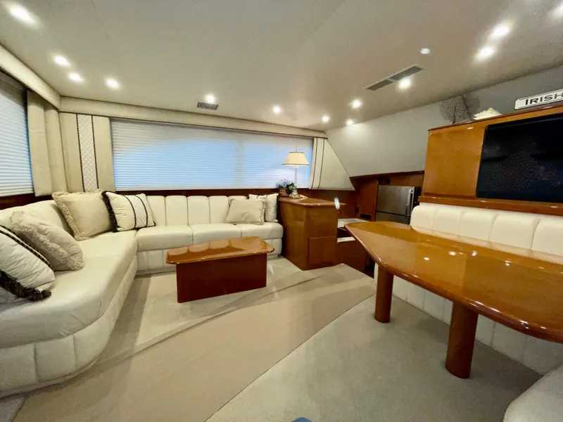 Slide: The Image of Luxurious interior of a 2001 Post 50 Convertible yacht with elegant seating and wooden accents. - 4