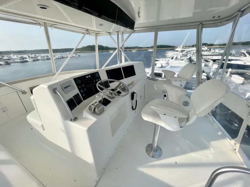 Slide: The Image of Helm of 2001 Post 50 Convertible yacht with marina view. - 46