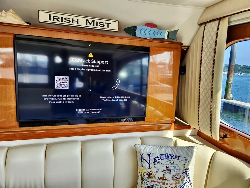 Slide: The Image of Interior of 2001 Post 50 Convertible yacht with TV and nautical decor. - 6