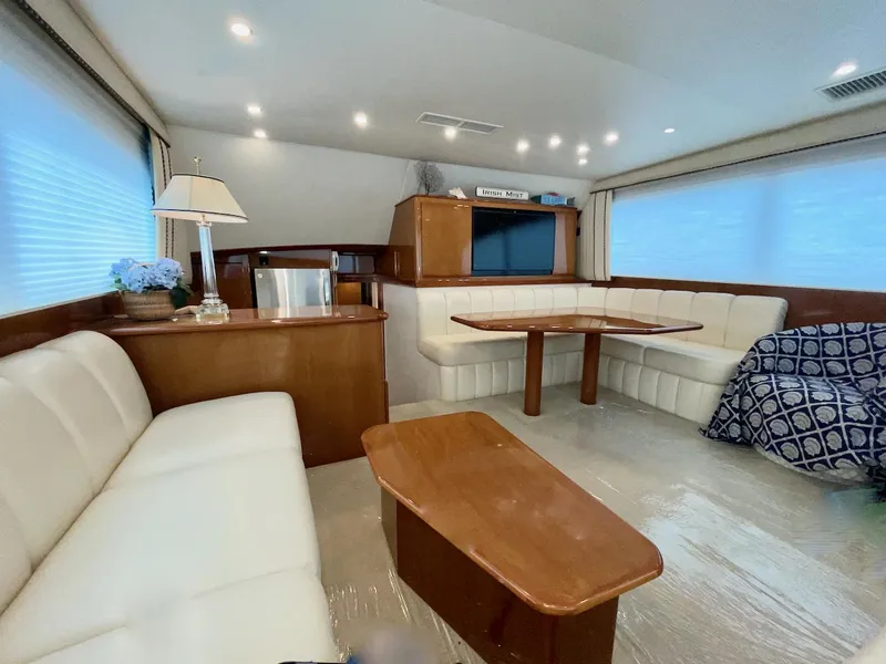 Slide: The Image of Luxurious interior of a 2001 Post 50 Convertible yacht with elegant seating and wooden furnishings. - 8