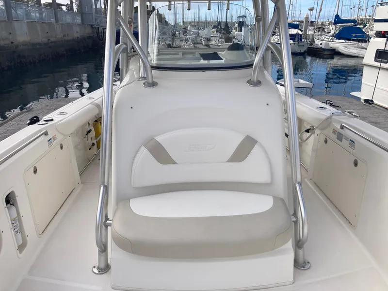 Slide: The Image of 2007 Boston Whaler 320 Outrage boat interior with seating, docked at marina. - 24