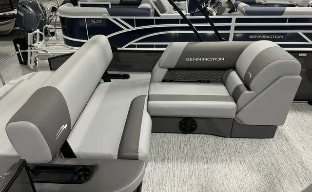 Slide: The Image of 2025 Bennington 23 SSB boat dashboard with steering wheel and control panel. - 11