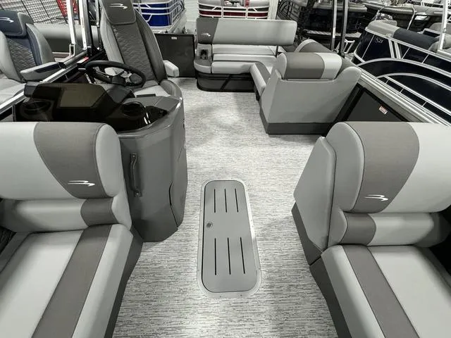 Slide: The Image of 2025 Bennington 23 SSB pontoon boat interior with gray seating and modern design. - 12