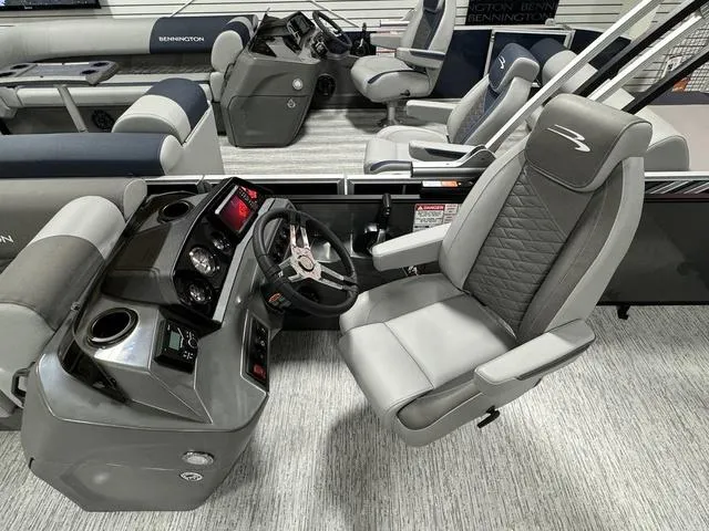 Slide: The Image of 2025 Bennington 23 SSB boat interior with modern helm and seating. - 18