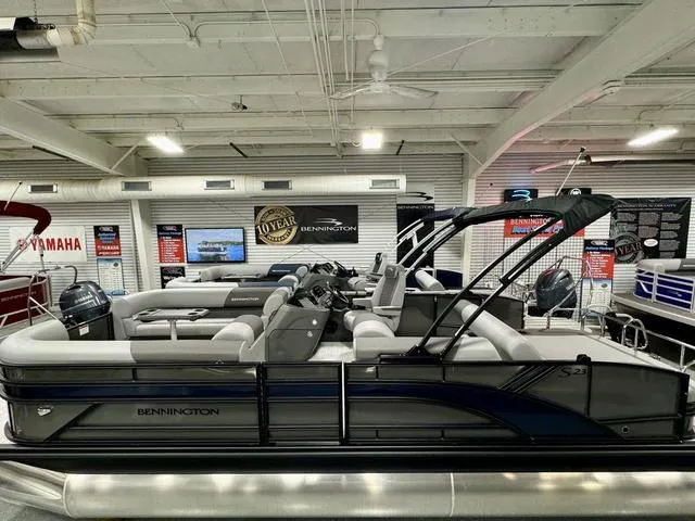 Slide: The Image of 2025 Bennington 23 SSB pontoon boat displayed in a showroom. - 3