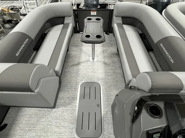 Slide: The Image of 2025 Bennington 23 SSB pontoon boat interior with gray seating and modern design. - 9