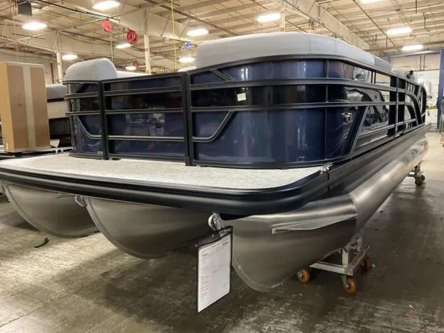 Slide: The Image of 2025 Bennington 23 SSB pontoon boat in a factory setting. - 3
