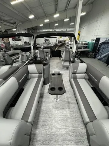 Slide: The Image of 2025 Bennington 22 SSR pontoon boat interior with gray seating and central table. - 10