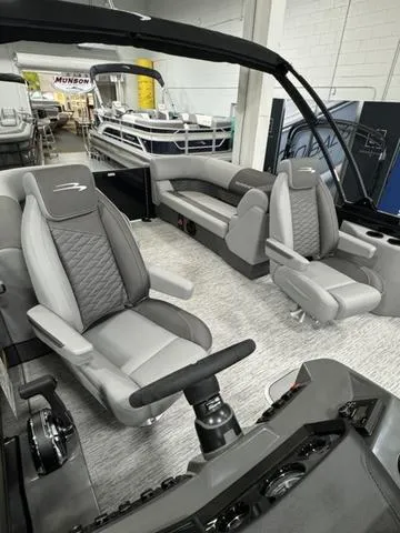 Slide: The Image of 2025 Bennington 22 SSR pontoon boat interior with modern seating and steering console. - 19