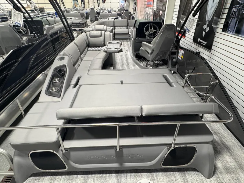 Slide: The Image of 2025 Bennington 25 RSB pontoon boat interior with luxurious gray seating and modern design. - 19