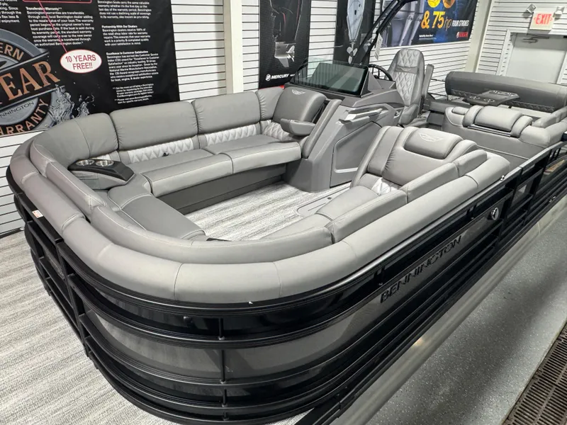 Slide: The Image of 2025 Bennington 25 RSB pontoon boat with luxurious gray seating and modern design. - 2
