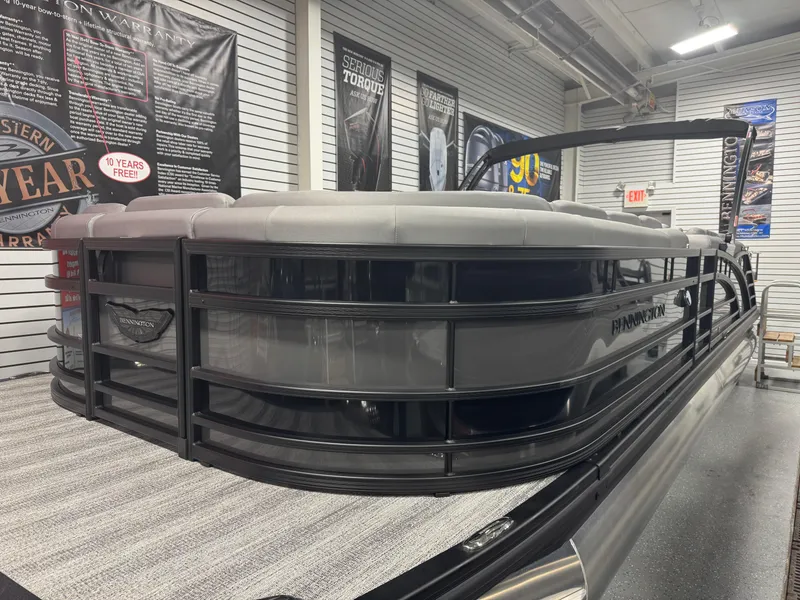 Slide: The Image of 2025 Bennington 25 RSB pontoon boat displayed in showroom, featuring sleek design and modern features. - 3