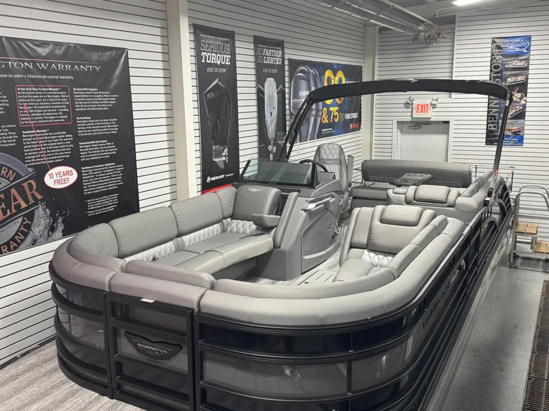 Slide: The Image of 2025 Bennington 25 RSB pontoon boat with luxurious seating in showroom. - 5