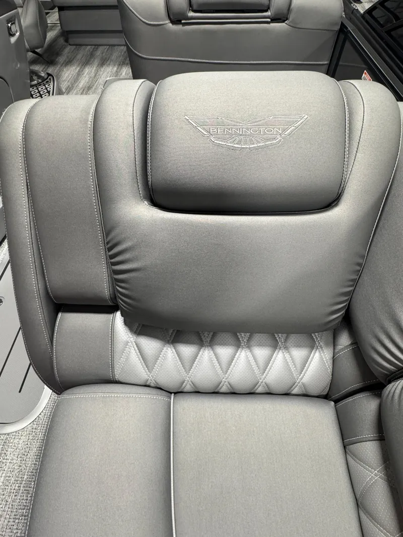 Slide: The Image of Luxurious seating in 2025 Bennington 25 RSB boat with elegant stitching and logo. - 8