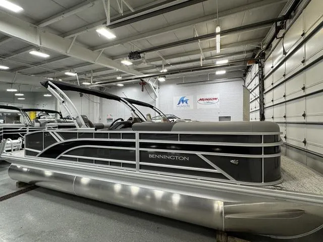 Slide: The Image of 2025 Bennington 22 SSB boat interior with gray seating and table. - 3