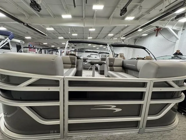 Slide: The Image of 2025 Bennington 22 SSB pontoon boat interior with gray seating and helm. - 5