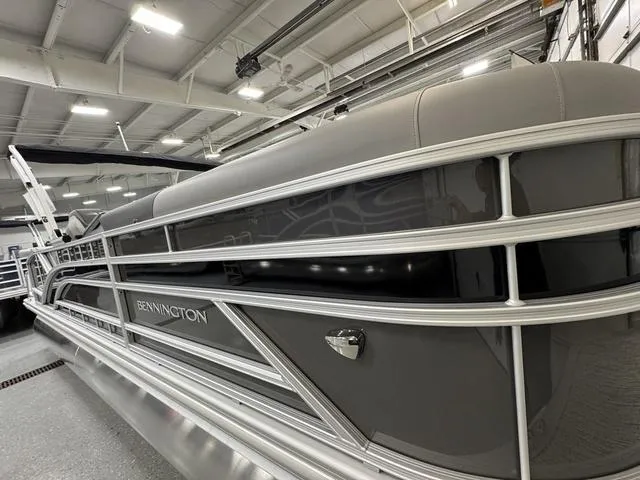 Slide: The Image of 2025 Bennington 22 SSB storage compartment with Garmin GPS device. - 8