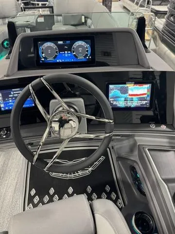 Slide: The Image of 2025 Bennington 25 RFBSE dashboard with advanced navigation and control displays. - 12