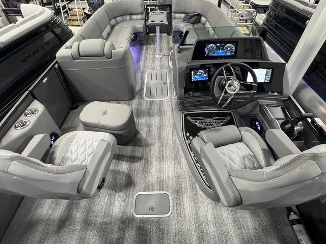 Slide: The Image of Luxurious interior of 2025 Bennington 25 RFBSE boat with plush gray seating and blue LED lighting. - 18