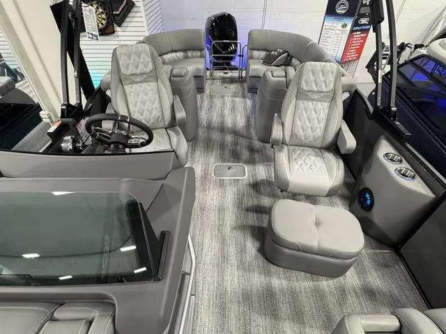Slide: The Image of Luxurious interior of 2025 Bennington 25 RFBSE pontoon boat with plush seating and ambient lighting. - 20