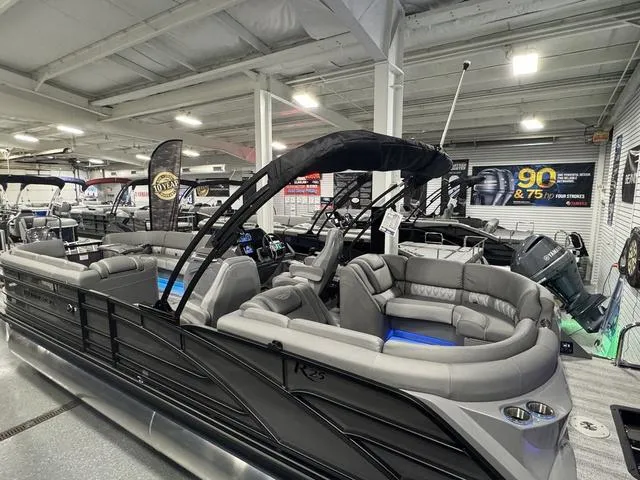Slide: The Image of 2025 Bennington 25 RFBSE boat interior with modern seating and illuminated speaker system. - 21