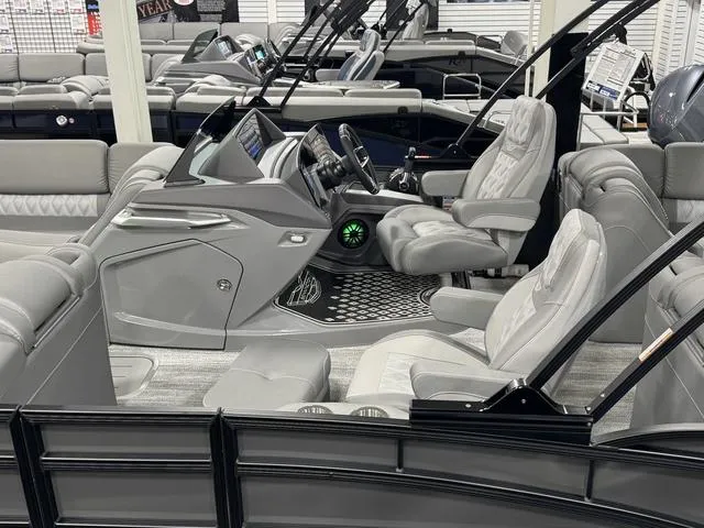 Slide: The Image of 2025 Bennington 25 RFBSE boat with Mercury engine, sleek interior, and modern design. - 22