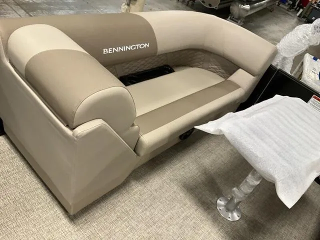 Slide: The Image of 2025 Bennington 22 SSR boat seating in beige and tan upholstery. - 6