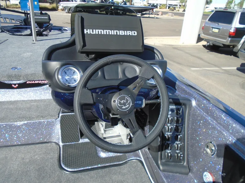 Slide: The Image of 2025 Phoenix 819 ZXL boat dashboard with Humminbird navigation system. - 11