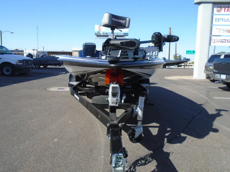 Slide: The Image of Front view of a 2025 Phoenix 819 ZXL boat on a trailer in a parking lot. - 14