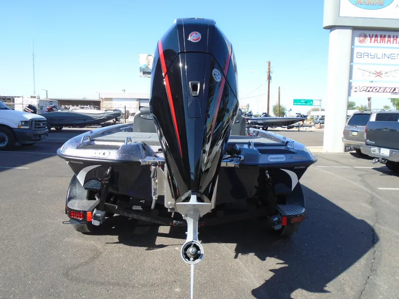Slide: The Image of 2025 Phoenix 819 ZXL boat with powerful outboard motor, displayed outdoors. - 6