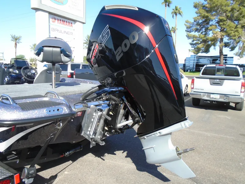 Slide: The Image of 2025 Phoenix 819 ZXL boat with powerful 200 HP engine in parking lot. - 7