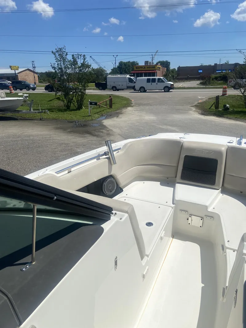 Slide: The Image of Interior view of a 2018 Boston Whaler 230 Vantage boat under sunny skies. - 13