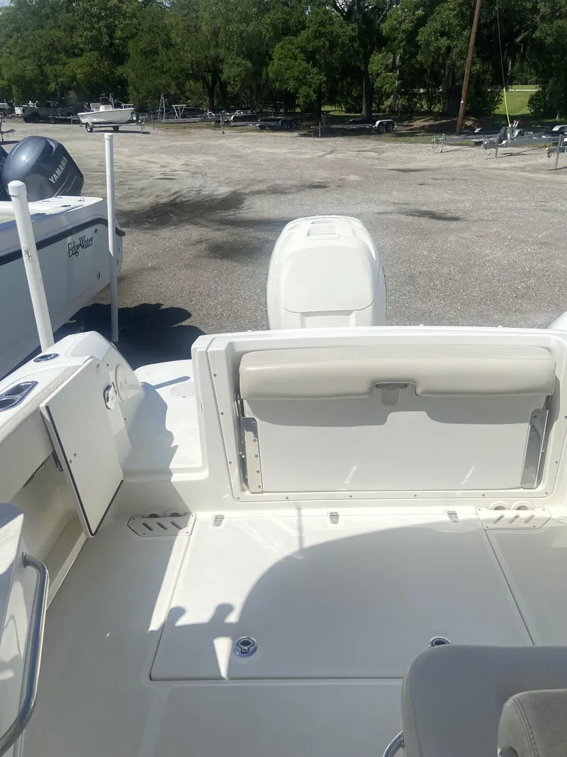 Slide: The Image of Interior view of a 2018 Boston Whaler 230 Vantage boat on a parking lot. - 4