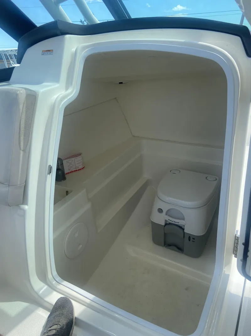 Slide: The Image of Interior of 2018 Boston Whaler 230 Vantage with toilet. - 8