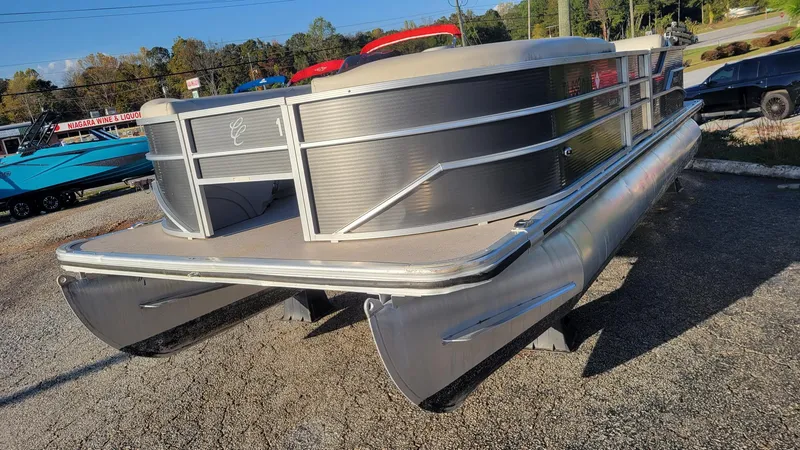 Slide: The Image of 2020 Cypress Cay Seabreeze 232 pontoon boat on display in a parking lot. - 5