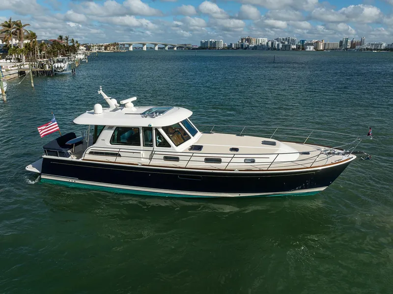 Slide: The Image of 2023 Sabre 48 Salon Express yacht cruising on a sunny day. - 15