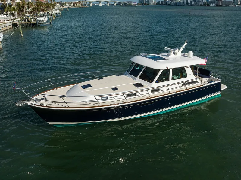 Slide: The Image of 2023 Sabre 48 Salon Express yacht cruising on a sunny day. - 20