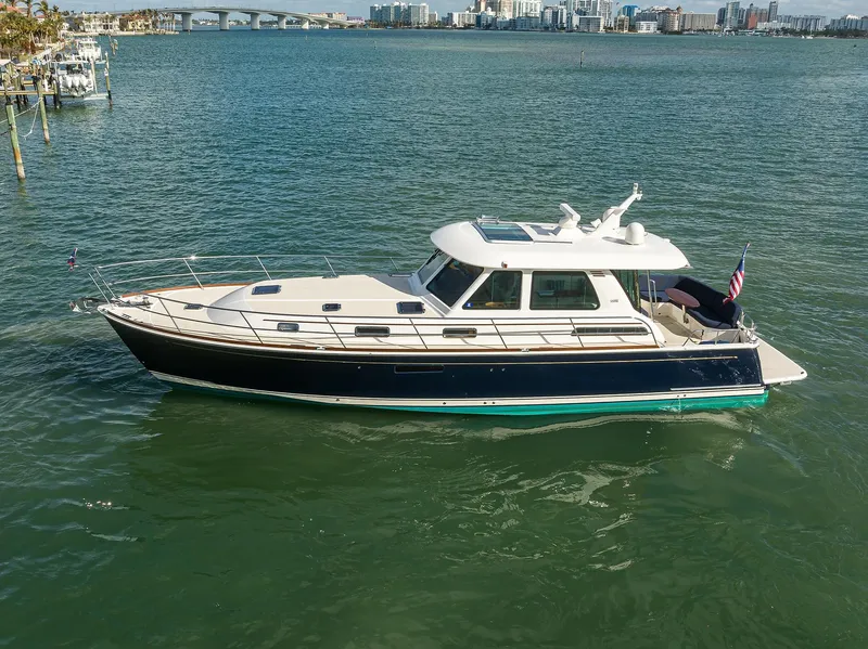 Slide: The Image of 2023 Sabre 48 Salon Express yacht cruising on calm waters. - 22