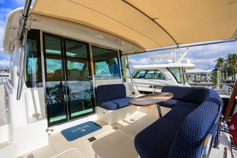 Slide: The Image of 2023 Sabre 48 Salon Express yacht with outdoor seating and canopy. - 46
