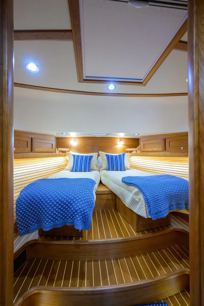Slide: The Image of Luxurious cabin interior of 2023 Sabre 48 Salon Express yacht with twin beds. - 48