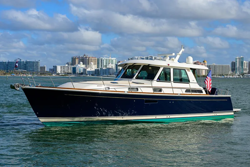 Slide: The Image of 2023 Sabre 48 Salon Express yacht cruising on a sunny day. - 5