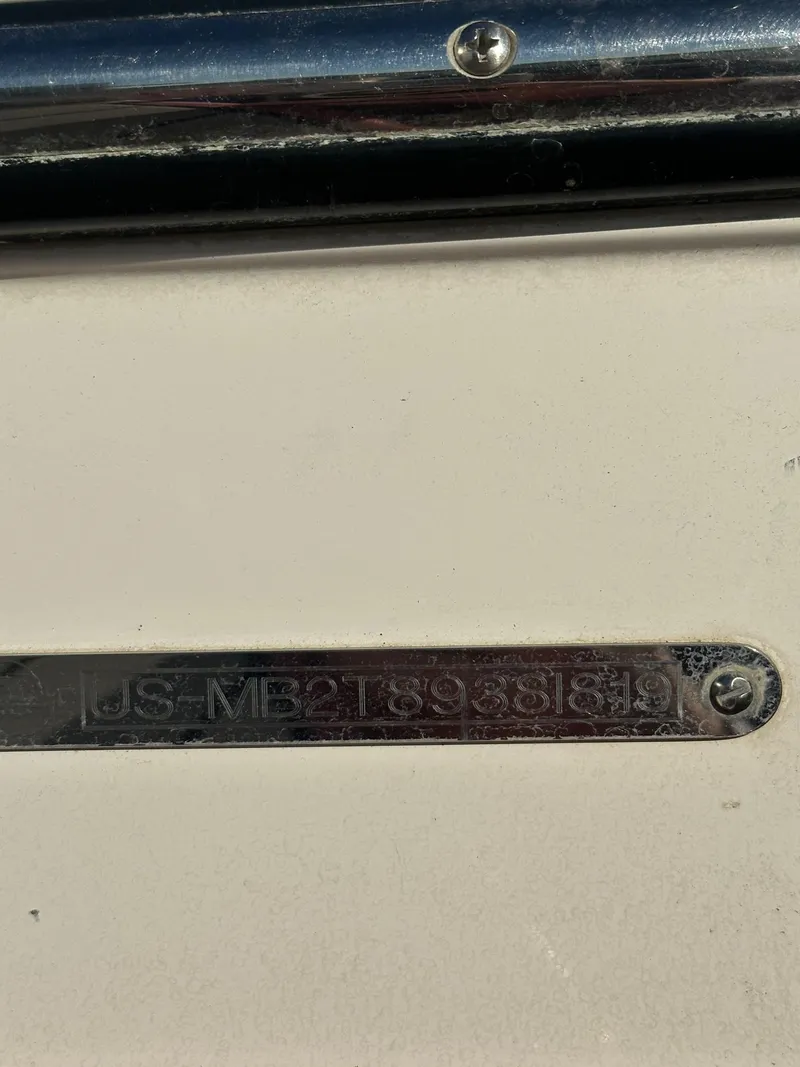 Slide: The Image of Close-up of a 2019 Malibu TXi Mo boat identification plate. - 19