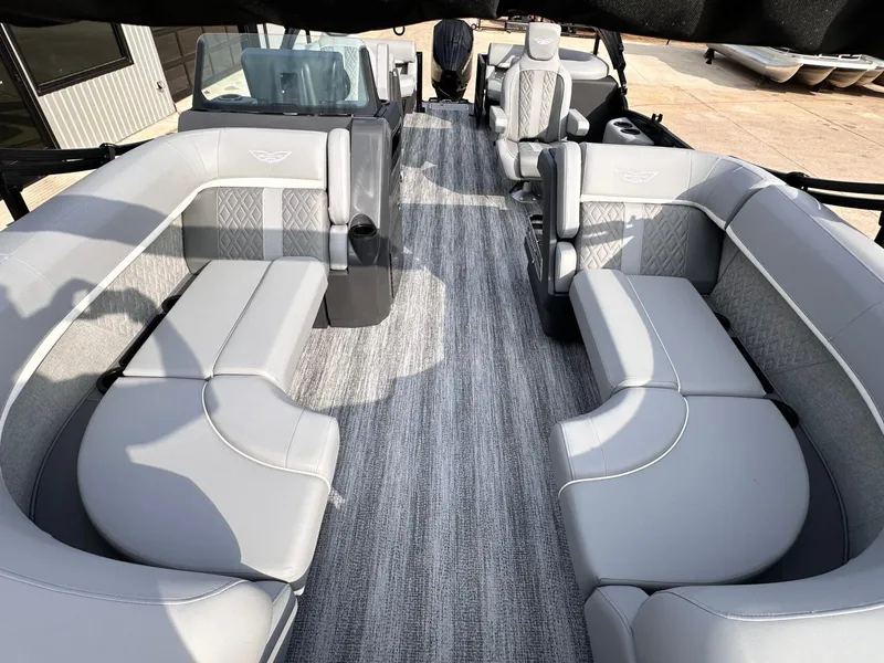 Slide: The Image of 2025 Bennington 22MFB pontoon boat interior with luxurious gray seating and modern design. - 12
