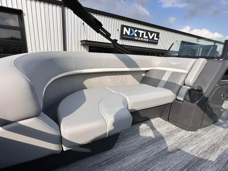 Slide: The Image of 2025 Bennington 22MFB boat interior with gray seating at NXT LVL Marine. - 13