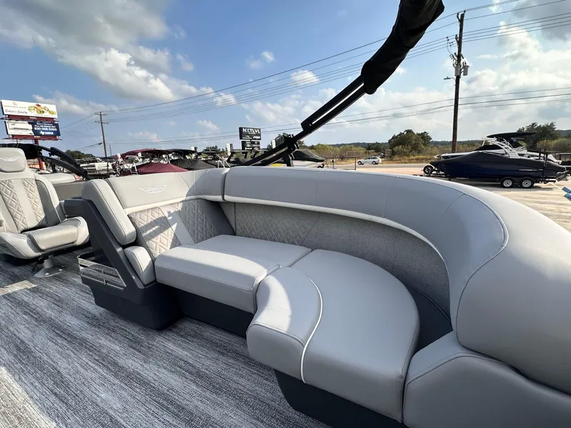 Slide: The Image of 2025 Bennington 22MFB boat interior with luxurious gray seating and modern design. - 14