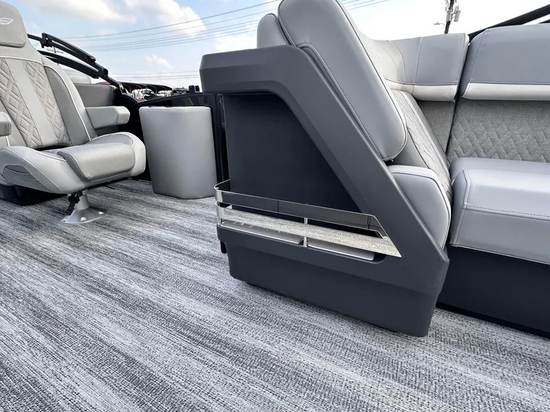 Slide: The Image of 2025 Bennington 22MFB boat interior with gray seating and modern design. - 18