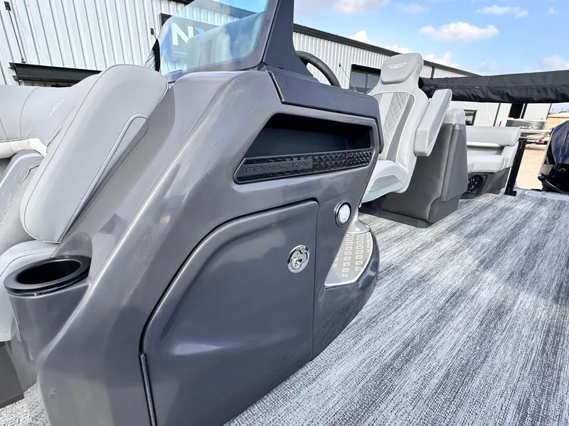 Slide: The Image of 2025 Bennington 22MFB boat interior with sleek gray console and seating. - 19