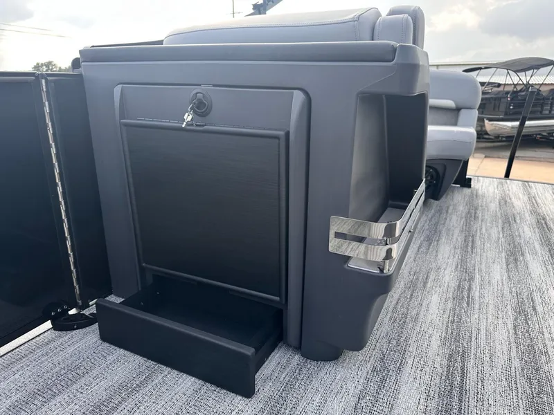 Slide: The Image of 2025 Bennington 22MFB boat interior with storage compartment and seating. - 20